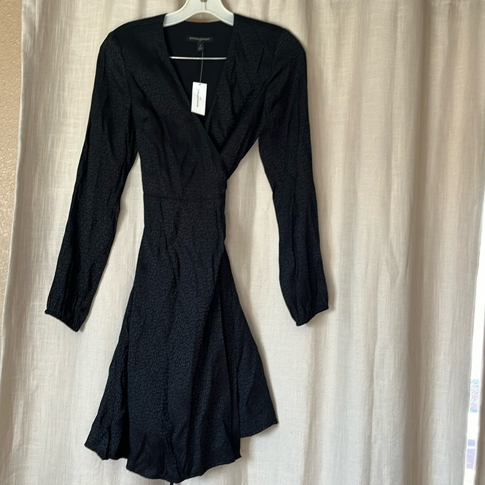 Beautiful wrap around black dress. Leopard print